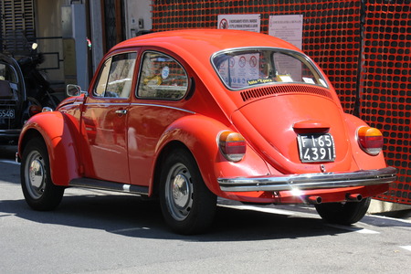 LASTRA A SIGNA, ITALY - AUGUST 30 2015: Vintage red beetle parked on the street in Lastra a Signa, Florenceのeditorial素材