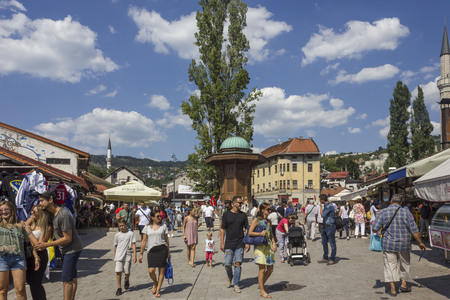 SARAJEVO, BOSNIA AND HERZEGOVINA - AUGUST 18 2017: Sarajevo city centre at day time in summer season, with the sebilj fountain and people aroundのeditorial素材
