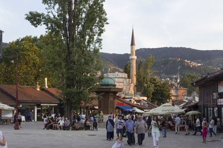 SARAJEVO, BOSNIA AND HERZEGOVINA - AUGUSt 18 2017: People around the famous Bascasija square in Sarajevo at sunset timeのeditorial素材