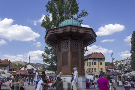 SARAJEVO, BOSNIA AND HERZEGOVINA - AUGUST 18 2017: Sarajevo city centre at day time in summer season, with the sebilj fountain and people aroundのeditorial素材