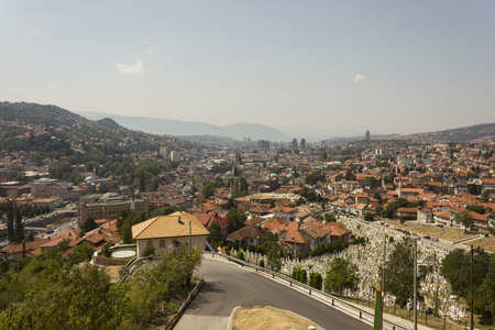 SARAJEVO, BOSNIA AND HERZEGOVINA - AUGUST 19 2017: View from the top of Yellow Fortess of the city of Sarajevo, with a huje war cemetery in the foregroundのeditorial素材