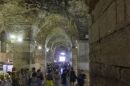 SPLIT, CROATIA - AUGUST 11 2017: Underground of Diocletian Palace in Split, with people along the corridorのeditorial素材