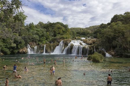 SIBENIK, CROATIA - AUGUST 12 2017: People bathing in Krka national park, through natureのeditorial素材