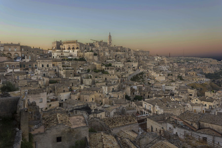 MATERA, ITALY - AUGUST 24 2017: Overview at sunset light of Matera city in Italy, Unesco world heritage siteのeditorial素材