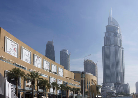 DUBAI, UAE - DECEMBER 26 2017: exterior of the Dubai Mall with its artificial lake and skyscrapers in the backgroundのeditorial素材