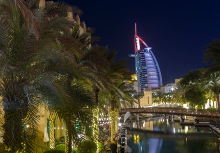 DUBAI, UAE - DECEMBER 29 2017: Night view of Burj al Arab from Madinat souqのeditorial素材