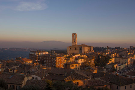 PERUGIA, ITALY - DECEMBER 9 2016: Perugia cityscape from the top at sunset, with San Domenico church in the backgroundのeditorial素材