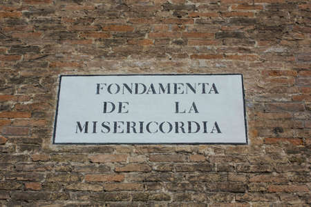 VENICE, ITALY - MAY 27 2016: Road sign of Fondamenta de la Misericordia  in Veniceのeditorial素材