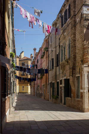VENICE, ITALY - MAY 28 2016: Ancient road in Venice with cloths hang out to dryのeditorial素材