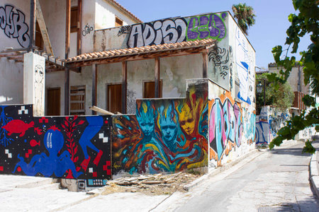 ATHENS, GREECE - AUGUST 13 2016: Ancient house in Athenswith drawings on the wallのeditorial素材