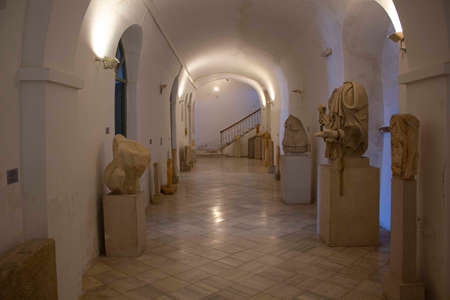 Naxos, Greece - August 18 2016: Traditional greek white church with blue dome through ruins rocks in Naxos island, Greeceのeditorial素材