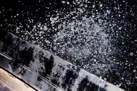 water drops explosion in the dark, from the boatの写真素材
