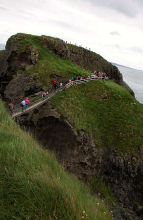 landscape with carrick-a-rede rope bridge, antrim coast, northern irelandの写真素材