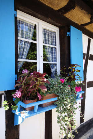 blue window in old country cottageのeditorial素材