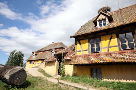 country house with stork's nest on the roofのeditorial素材
