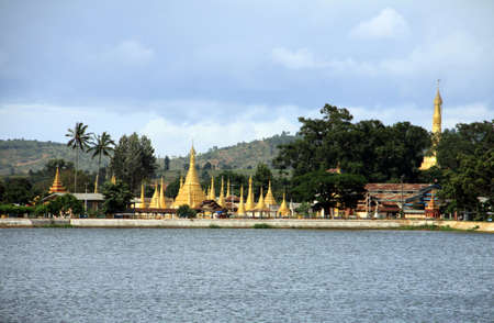 golden buddhist temple on a lake in Pindaya, Myanmarの写真素材