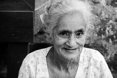 old Myanmar smiling woman portrait in black and whiteのeditorial素材