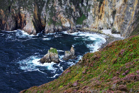 Slieve League cliffs and the sea in a small bay, Donegal, Irelandの写真素材