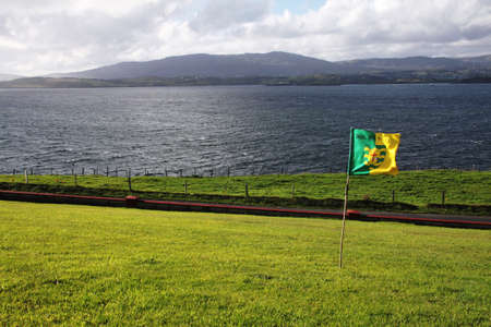 County Donegal flag on a green meadow in St. John's Point, Killibegs, Donegalの写真素材