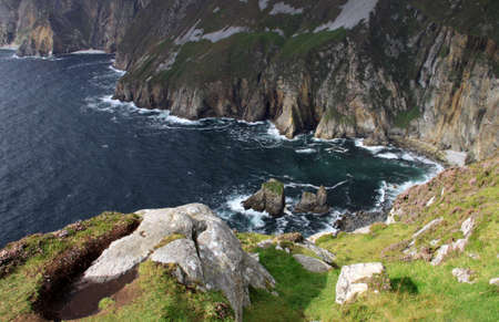 Slieve Leage cliffs and the sea in a small bay, Donegal, Irelandの写真素材