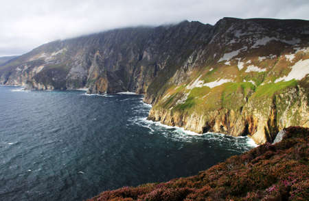 Slieve Leage cliffs and landscape on Atlantic ocean with cloudy weather in Donegal, Irelandの写真素材