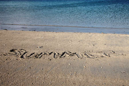 the word summer type on the wet sand in Donegal, Irelandの写真素材