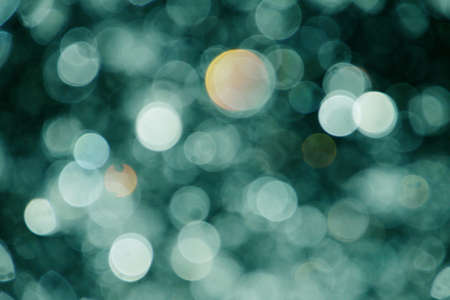 abstract green lights background, made from water drops and rainの写真素材