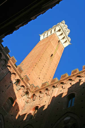Diagonal view of the tallest tower in Siena, Tuscany, Italyの写真素材