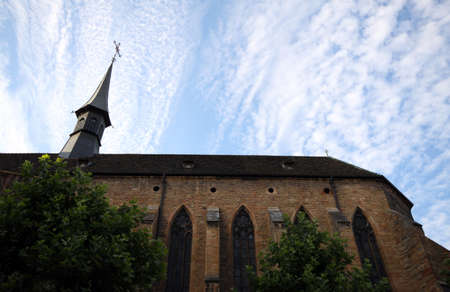 Colmar church from the base, and cloudy skyの写真素材