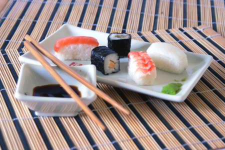 sushi meal with soy sause and wood chopsticksの写真素材