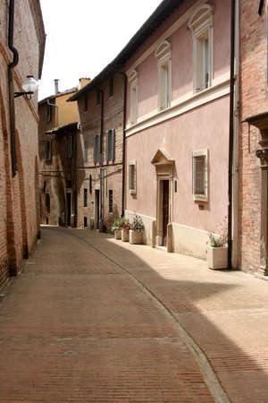 typical lane in the historical downtown Urbino, Italyの写真素材