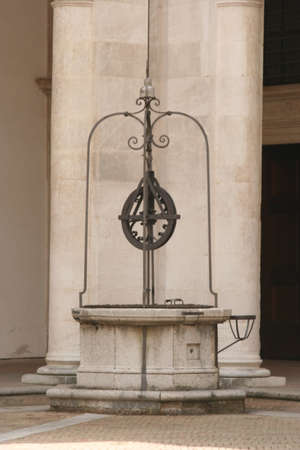 Classical old-style well in downtown Urbino, central Italyの写真素材