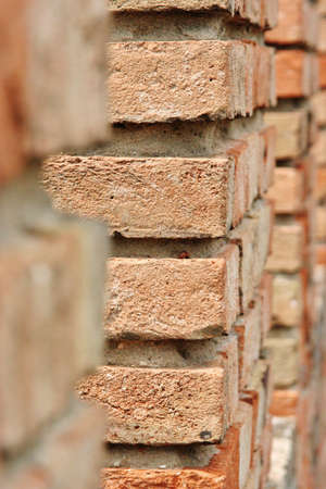 detail of wall made of red bricks, selective focusの写真素材