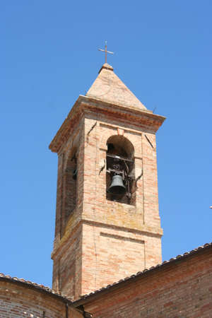 Bell tower made of red bricks, middle-age architecture in central Italyの写真素材