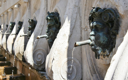 Historical fountain with bronze faces in Ancona, Marche, Italyのeditorial素材