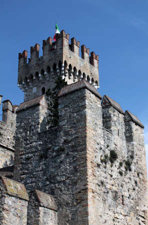 Tower of Sirmione Castle with italian flag, Garda Lake, Italyのeditorial素材