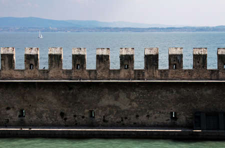 external wall of Sirmione Castle with Garda lake landscape, Sirmione, nothern Italyのeditorial素材