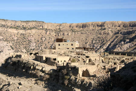 Panoramic view of a restaurant in the middle of a canyon in Dana Natural reserve, Jordanの写真素材