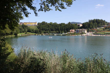 Lavarone lake in foreground with the Grand hotel in the background. Folgaria upland. Trentino, Italyの写真素材