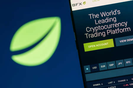KYRENIA, CYPRUS - OCTOBER 3, 2018: Bitfinex website displayed on the smartphone screen. Bitfinex is a cryptocurrency trading platform.のeditorial素材