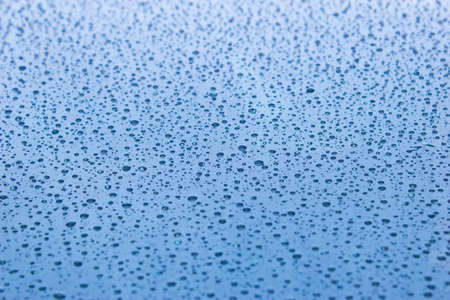 Multitude of raindrops on car windshieldの写真素材