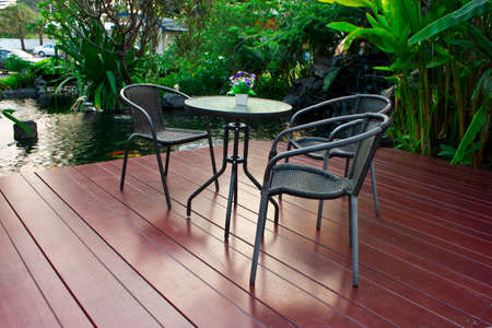 The outdoor coffee table in a beautiful gardenの写真素材