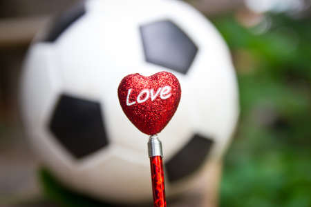 Red heart with football  love football concept の写真素材