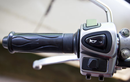 Horn switch on a motorcycle handlebar の写真素材