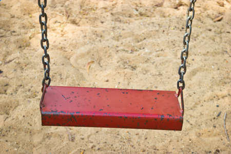 Empty swing in playground park.の写真素材