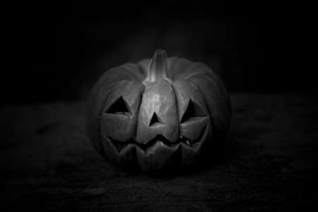 Halloween background. Black pumpkins in dark (Soap carved)の写真素材