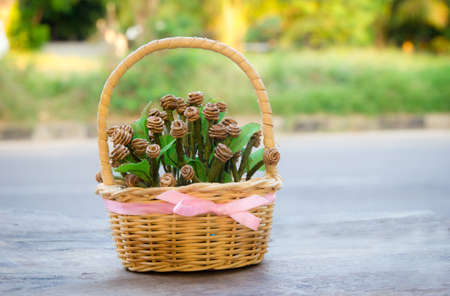 Wood table set decorated with artificial flowersの写真素材