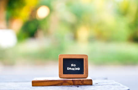Wooden no smoking sign on dining tableの写真素材
