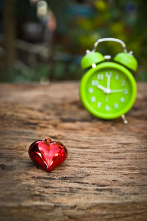 Red hearts with vintage alarm clock. Time in love.の写真素材