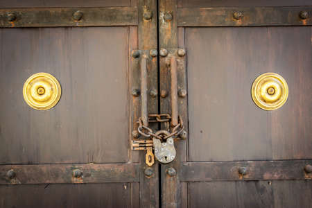 Security , closeup of a closed padlock. Old antique system of protecting vauluables.の写真素材